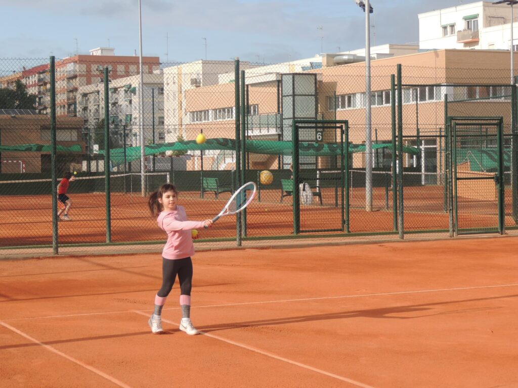 Girl practicing tennis